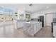 Modern kitchen features a large island, bright windows, and stainless steel appliances at 7472 E Black Rock Rd, Scottsdale, AZ 85255