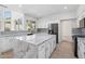 Bright kitchen features a large island with marble countertop and stainless steel appliances at 7472 E Black Rock Rd, Scottsdale, AZ 85255
