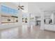 Open-concept living room with bright windows, tile floors, and seamless flow to the kitchen at 7472 E Black Rock Rd, Scottsdale, AZ 85255