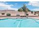Beautiful pool area with a well-maintained pool and surrounding landscaped yard at 7472 E Black Rock Rd, Scottsdale, AZ 85255