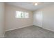 This cozy bedroom features neutral walls, tile flooring, and a window for natural light at 8227 E Heatherbrae Dr, Scottsdale, AZ 85251
