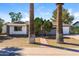 Charming single-story home with mature landscaping and a brick walkway at 8227 E Heatherbrae Dr, Scottsdale, AZ 85251