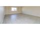 Open living room with tile floors and a window offering natural light at 8227 E Heatherbrae Dr, Scottsdale, AZ 85251