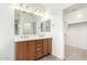Bathroom vanity with double sinks and a large mirror offering space and style at 9148 W Meadow Dr, Peoria, AZ 85382