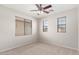 Bedroom featuring neutral colored carpet and multiple windows for ample natural light at 9148 W Meadow Dr, Peoria, AZ 85382