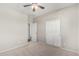 Bedroom features a ceiling fan and closet, perfect for any homeowner at 9148 W Meadow Dr, Peoria, AZ 85382