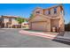 Two-story home featuring a two-car garage and a desert-style landscaped yard at 9148 W Meadow Dr, Peoria, AZ 85382
