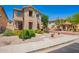 Charming two-story home with well-maintained landscaping, stone yard, and a welcoming walkway at 9148 W Meadow Dr, Peoria, AZ 85382