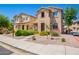 Charming two-story home with well-maintained landscaping, stone yard, and a welcoming walkway at 9148 W Meadow Dr, Peoria, AZ 85382
