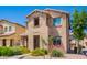 Charming two-story home with well-maintained landscaping, stone yard, and a welcoming walkway at 9148 W Meadow Dr, Peoria, AZ 85382
