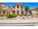 Charming two-story home with well-maintained landscaping, stone yard, and a welcoming walkway at 9148 W Meadow Dr, Peoria, AZ 85382