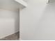 A hallway with neutral walls and floors provides passage throughout the residence at 9148 W Meadow Dr, Peoria, AZ 85382