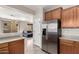 Kitchen featuring stainless steel refrigerator and plenty of cabinet space at 9148 W Meadow Dr, Peoria, AZ 85382