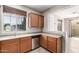 Bright kitchen with a stainless steel dishwasher and a window overlooking the neighborhood at 9148 W Meadow Dr, Peoria, AZ 85382