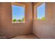 Patio space with stucco walls and view of the neighborhood trees at 9148 W Meadow Dr, Peoria, AZ 85382