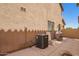 Spacious private patio with room for outdoor dining and an air conditioning unit at 9148 W Meadow Dr, Peoria, AZ 85382