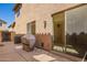 Private outdoor patio area with a covered grill and sliding glass door entrance at 9148 W Meadow Dr, Peoria, AZ 85382