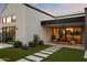 Beautiful backyard featuring lush artificial turf, a modern patio, and an outdoor dining area at 1013 W Ardmore Rd, Phoenix, AZ 85041