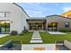 Beautiful backyard featuring lush artificial turf, a modern patio, and an outdoor dining area at 1013 W Ardmore Rd, Phoenix, AZ 85041