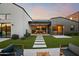 Beautiful backyard featuring lush artificial turf, a modern patio, and an outdoor dining area at 1013 W Ardmore Rd, Phoenix, AZ 85041