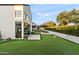 Backyard with a putting green, modern patio, and view of the sleek, contemporary home design at 1013 W Ardmore Rd, Phoenix, AZ 85041