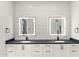 Contemporary bathroom with dual vanities, quartz countertops, and backlit mirrors at 1013 W Ardmore Rd, Phoenix, AZ 85041