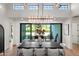 Elegant dining room with modern chandelier and view to the patio at 1013 W Ardmore Rd, Phoenix, AZ 85041