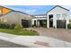 Exterior view with a modern black garage door and a green lawn at 1013 W Ardmore Rd, Phoenix, AZ 85041