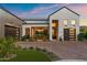 Beautiful modern home with manicured landscaping, brick driveway, and attached two-car garage at 1013 W Ardmore Rd, Phoenix, AZ 85041