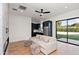 Bright living room features modern finishes, sleek ceiling fan, and sliding doors to backyard at 1013 W Ardmore Rd, Phoenix, AZ 85041