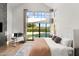 Bright main bedroom with high ceilings and natural light, looking out to the backyard at 1013 W Ardmore Rd, Phoenix, AZ 85041