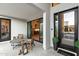 Outdoor patio space with modern furniture, sliding glass doors, and a view into the kitchen at 1013 W Ardmore Rd, Phoenix, AZ 85041