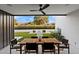 Covered patio features outdoor seating with a view of the serene backyard and desert landscape at 1013 W Ardmore Rd, Phoenix, AZ 85041