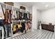 Walk-in closet showcasing custom shelving and drawers offers ample space for clothing and accessories at 1013 W Ardmore Rd, Phoenix, AZ 85041