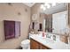 Cozy bathroom featuring a vanity, coordinated accessories, and a shower-tub combination with a patterned curtain at 10541 W Foothill Dr, Peoria, AZ 85383