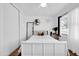 Bright bedroom featuring white walls, hardwood floors, and view to the exterior at 10541 W Foothill Dr, Peoria, AZ 85383