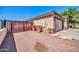 Home exterior with tile roof, three car garage, and block wall fencing at 10541 W Foothill Dr, Peoria, AZ 85383