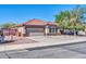 Charming single-story home with a red tile roof, desert landscaping, and a two-car garage at 10541 W Foothill Dr, Peoria, AZ 85383