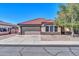 Charming single-story home with a red tile roof, desert landscaping, and a two-car garage at 10541 W Foothill Dr, Peoria, AZ 85383