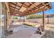 Covered patio featuring string lights, a ceiling fan, and view of a sand box at 10541 W Foothill Dr, Peoria, AZ 85383