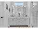 Bright modern bathroom featuring a double sink vanity, large mirror, and sleek finishes at 1071 N Danyell Dr, Chandler, AZ 85225