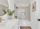 Bathroom featuring round mirror and marble backsplash at 1071 N Danyell Dr, Chandler, AZ 85225