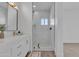 A modern bath boasts a glass shower and white marble tiling at 1071 N Danyell Dr, Chandler, AZ 85225