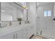 Modern bathroom featuring double vanity sinks, white marble, and a glass enclosed shower at 1071 N Danyell Dr, Chandler, AZ 85225