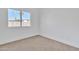 Carpeted room showcasing a bright window and neutral colors at 1071 N Danyell Dr, Chandler, AZ 85225