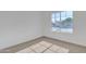 Bright bedroom featuring plush carpet and a sunlit window with neighborhood view at 1071 N Danyell Dr, Chandler, AZ 85225