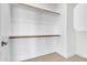 A simple, spacious walk in closet with wooden railings for ample hanging storage at 1071 N Danyell Dr, Chandler, AZ 85225
