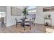Bright dining room features an arched window, modern decor, and wood floors at 1071 N Danyell Dr, Chandler, AZ 85225