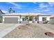 Charming single-story home featuring a well-manicured yard, neutral color palette, and a two-car garage at 1071 N Danyell Dr, Chandler, AZ 85225