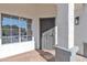 Covered front porch with a decorative security door and a view of the window and column details at 1071 N Danyell Dr, Chandler, AZ 85225